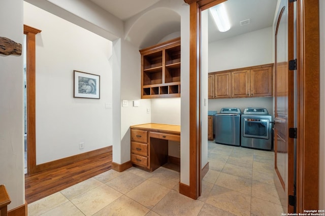 4001 Bell Springs Rd, Dripping Springs, TX 78620 - interior space with baseboards, visible vents, separate washer and dryer, built in study area, and light tile patterned floors
