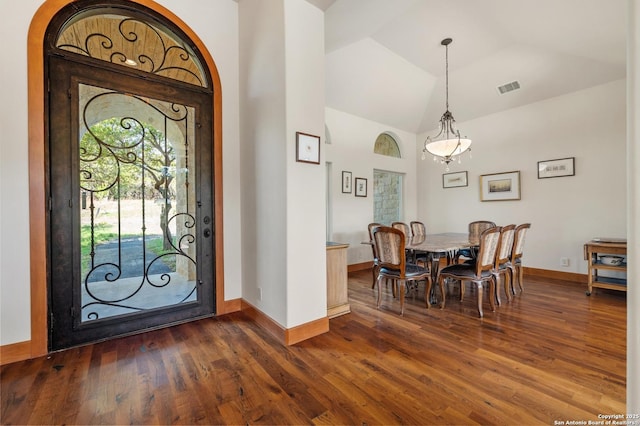 4001 Bell Springs Rd, Dripping Springs, TX 78620 - entrance foyer with baseboards, vaulted ceiling, visible vents, and dark wood-style flooring