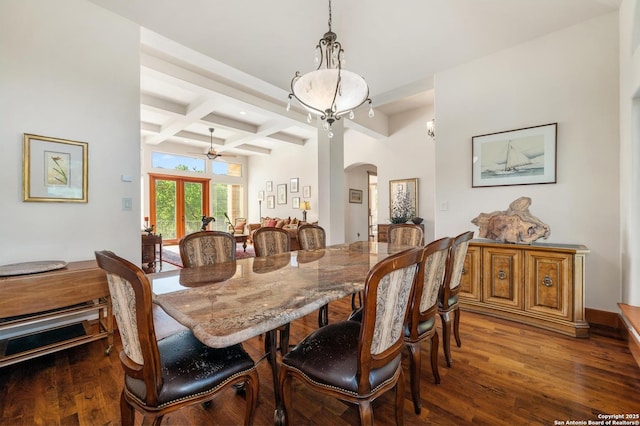 4001 Bell Springs Rd, Dripping Springs, TX 78620 - dining area featuring beamed ceiling, wood finished floors, arched walkways, and coffered ceiling
