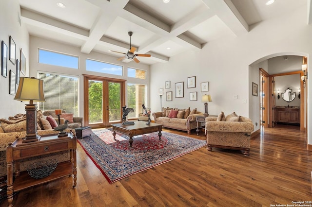 4001 Bell Springs Rd, Dripping Springs, TX 78620 - living room with arched walkways, a healthy amount of sunlight, beam ceiling, and ceiling fan