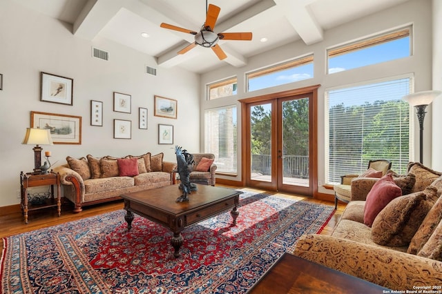 4001 Bell Springs Rd, Dripping Springs, TX 78620 - living area with wood finished floors, visible vents, a ceiling fan, and beam ceiling