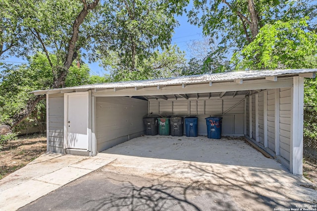 view of parking featuring a carport and driveway
