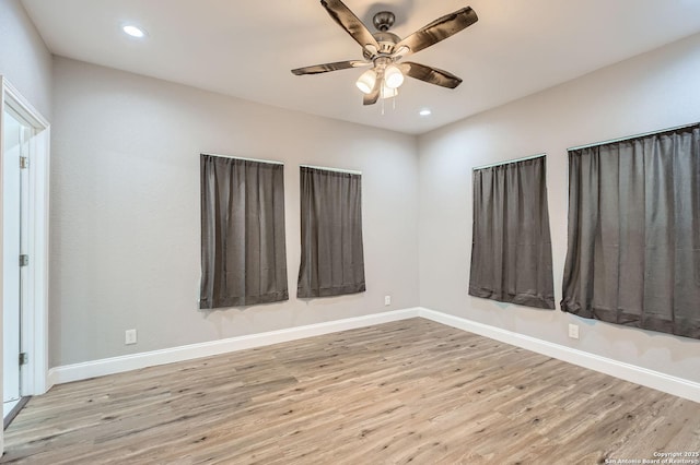 unfurnished room with recessed lighting, wood finished floors, baseboards, and ceiling fan