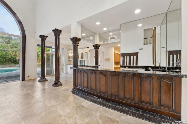 welcome area featuring visible vents and ornate columns