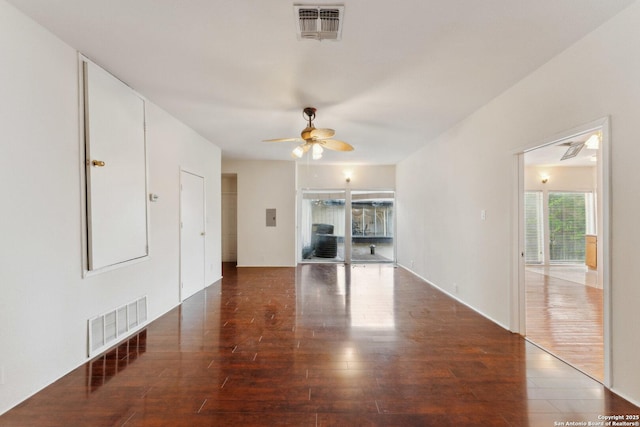 unfurnished living room with wood finished floors, visible vents, and ceiling fan