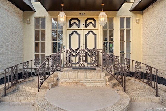 view of exterior entry featuring covered porch