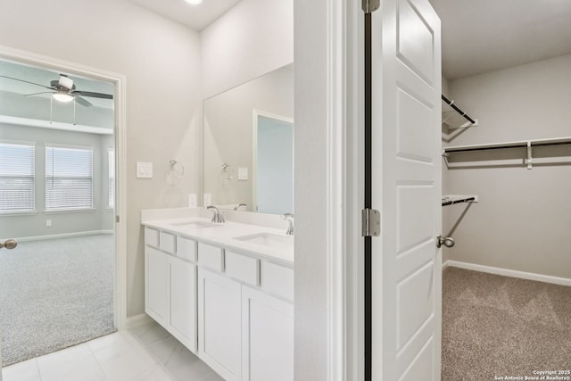 9814 Prairie Way, San Antonio, TX 78245 - bathroom featuring double vanity, ceiling fan, and a spacious closet