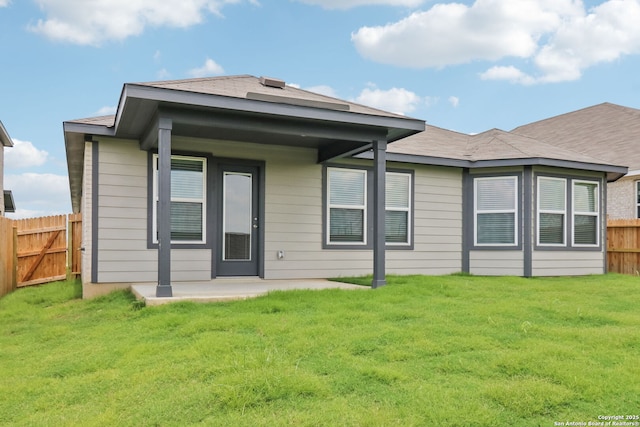 9814 Prairie Way, San Antonio, TX 78245 - rear view of house with a fenced backyard and a patio area