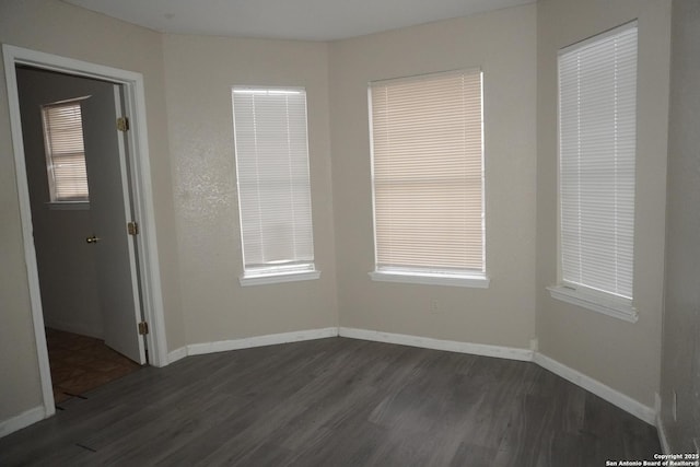 8826 Dream Ave, Converse, TX 78109 - empty room featuring baseboards and dark wood-style flooring