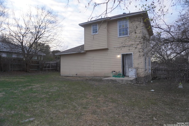 8826 Dream Ave, Converse, TX 78109 - rear view of house with a lawn and fence