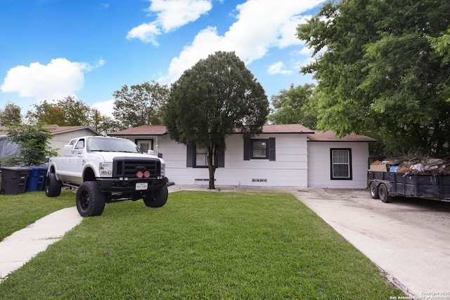 ranch-style house with crawl space, a shingled roof, and a front yard