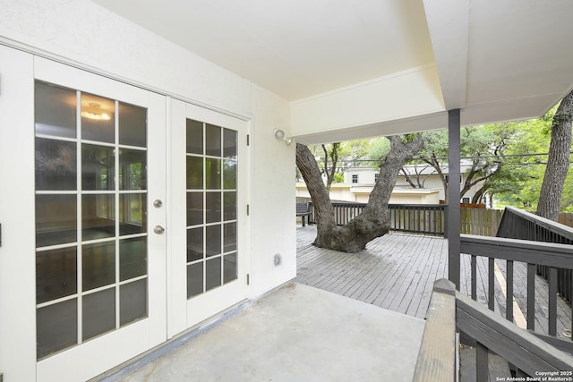 exterior space with french doors and a deck