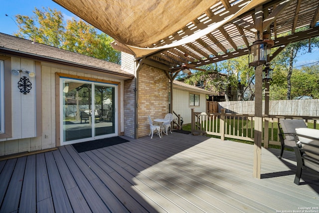 deck featuring a pergola and fence