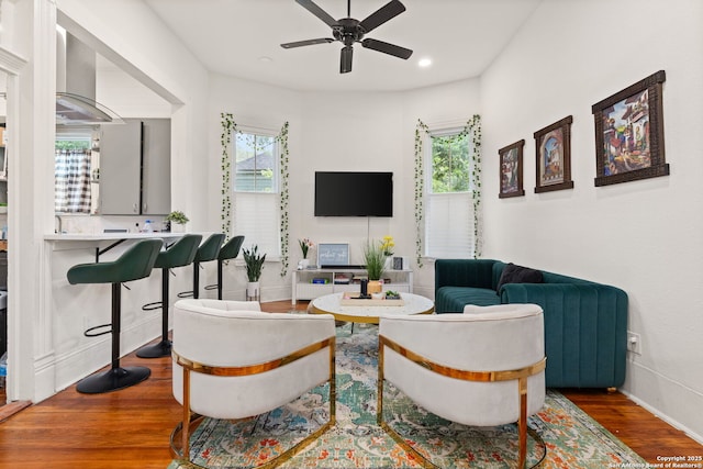 living room featuring recessed lighting, wood finished floors, a wealth of natural light, and a ceiling fan