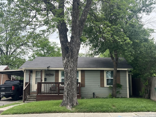 1244 Clower, San Antonio, TX 78201 - ranch-style home featuring an attached carport and a front lawn