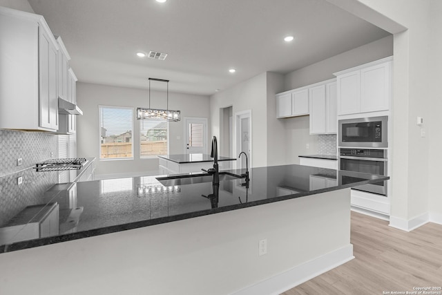 133 Bailey Blf, San Antonio, TX 78253 - kitchen featuring visible vents, white cabinets, a sink, appliances with stainless steel finishes, and recessed lighting
