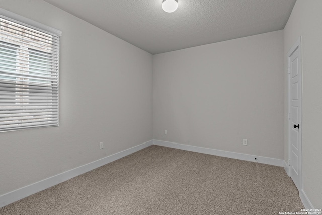 133 Bailey Blf, San Antonio, TX 78253 - empty room with carpet floors, baseboards, and a textured ceiling
