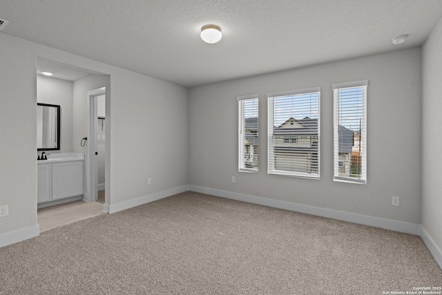 133 Bailey Blf, San Antonio, TX 78253 - empty room featuring visible vents, baseboards, light carpet, and a textured ceiling