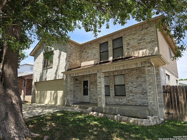 5026 Pine Lk, San Antonio, TX 78244 - view of front facade with fence, driveway, brick siding, and a garage