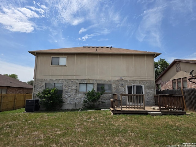 5026 Pine Lk, San Antonio, TX 78244 - rear view of house featuring a deck, fence, a yard, cooling unit, and brick siding