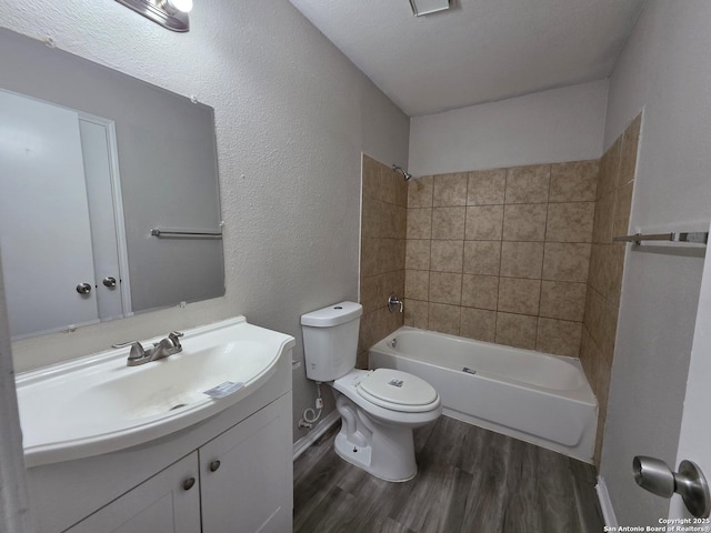 5026 Pine Lk, San Antonio, TX 78244 - bathroom with wood finished floors, toilet, vanity, and bathtub / shower combination