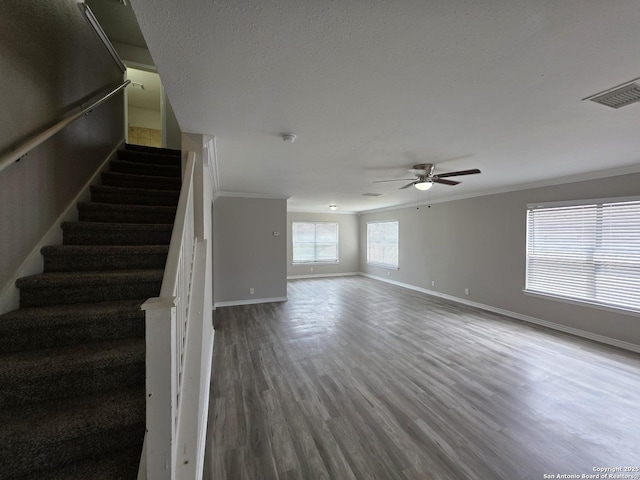 5026 Pine Lk, San Antonio, TX 78244 - unfurnished living room featuring baseboards, a ceiling fan, wood finished floors, stairway, and crown molding