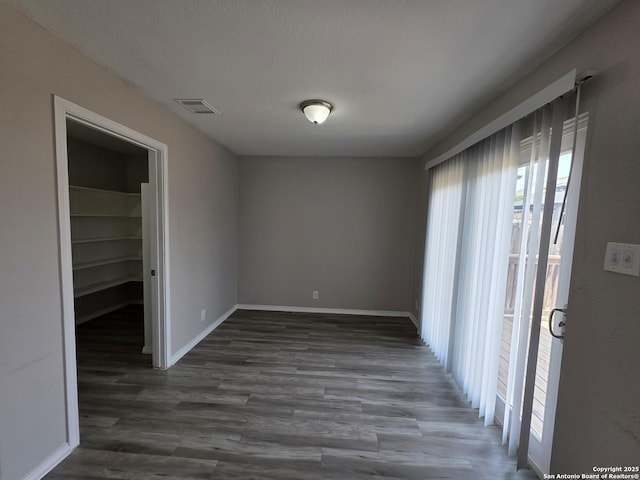 5026 Pine Lk, San Antonio, TX 78244 - unfurnished dining area with baseboards, wood finished floors, and visible vents