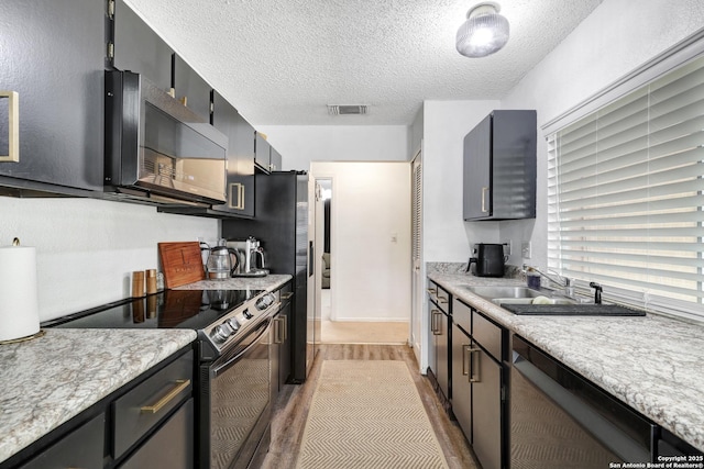 6807 Burnley, San Antonio, TX 78239 - kitchen featuring light countertops, dishwasher, electric stove, visible vents, and a sink