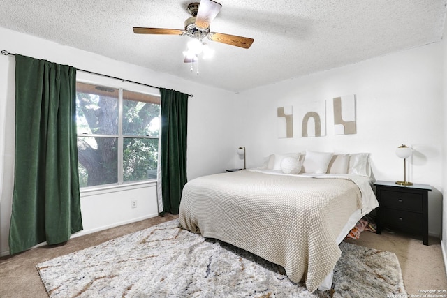 6807 Burnley, San Antonio, TX 78239 - bedroom featuring ceiling fan, carpet flooring, and a textured ceiling