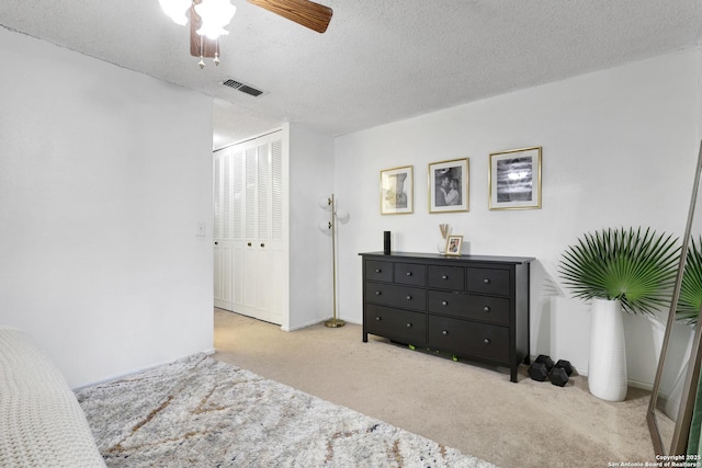 6807 Burnley, San Antonio, TX 78239 - carpeted bedroom with a ceiling fan, visible vents, a textured ceiling, and a closet
