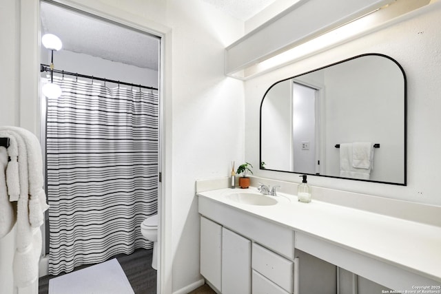 6807 Burnley, San Antonio, TX 78239 - full bath with a shower with curtain, vanity, and toilet