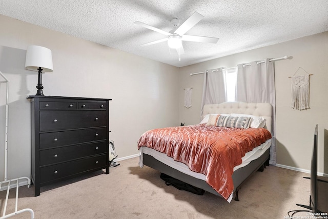 6807 Burnley, San Antonio, TX 78239 - bedroom featuring a ceiling fan, baseboards, a textured ceiling, and light colored carpet