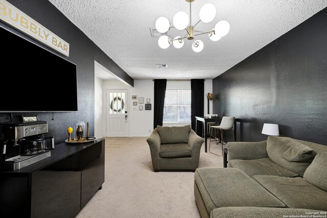 6807 Burnley, San Antonio, TX 78239 - living area with visible vents, a textured ceiling, a notable chandelier, and light colored carpet