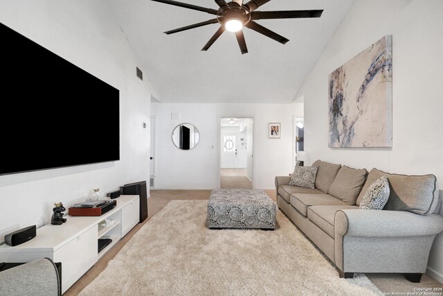 6807 Burnley, San Antonio, TX 78239 - living area with light carpet, a ceiling fan, visible vents, and high vaulted ceiling