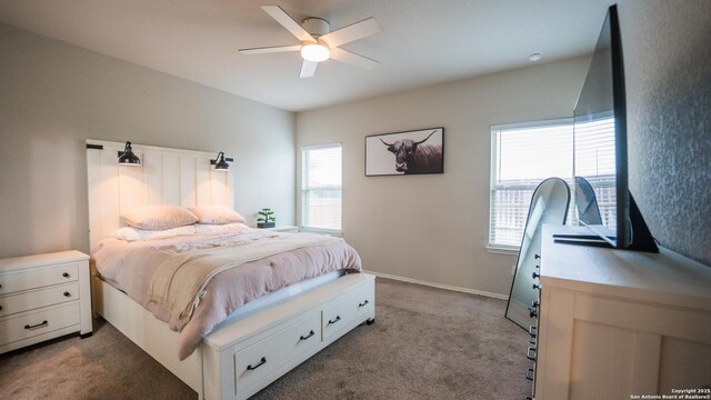 bedroom with ceiling fan and carpet flooring