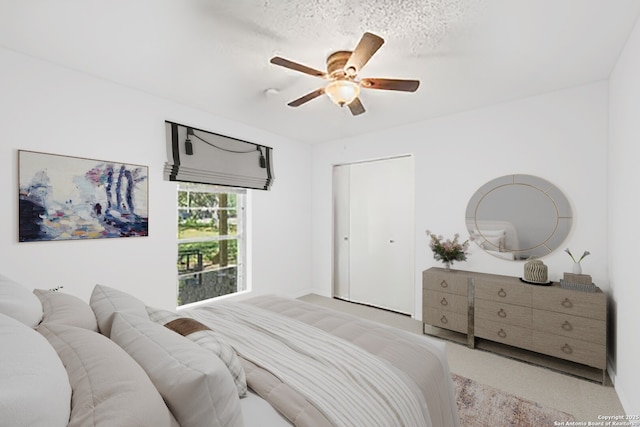 9416 Geronimo Vw, San Antonio, TX 78254 - bedroom featuring ceiling fan, a closet, and baseboards