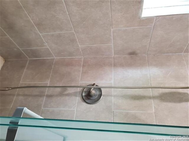 room details with a tile shower