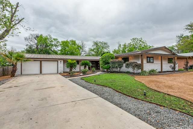 105 Parade, San Antonio, TX 78213 - ranch-style house with a garage, concrete driveway, brick siding, a front yard, and metal roof