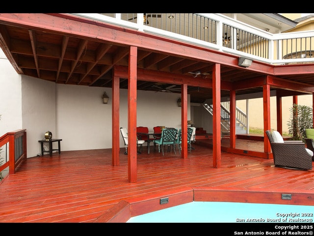 deck with outdoor dining area