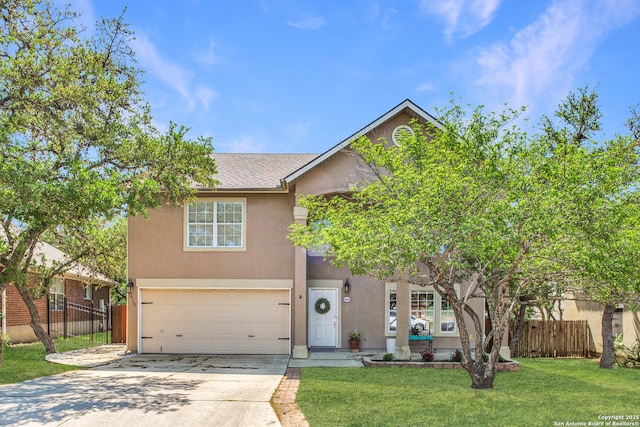 view of front facade with stucco siding, an attached garage, fence, and driveway