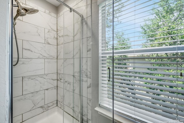 full bath featuring a shower stall
