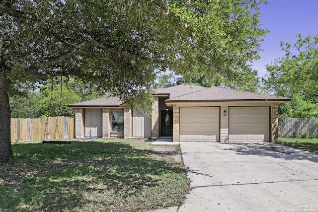 9400 Woodland Hls, San Antonio, TX 78250 - view of front of property featuring a front lawn, driveway, fence, and a garage