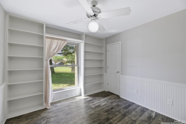 9400 Woodland Hls, San Antonio, TX 78250 - spare room with a ceiling fan, built in features, and dark wood-type flooring