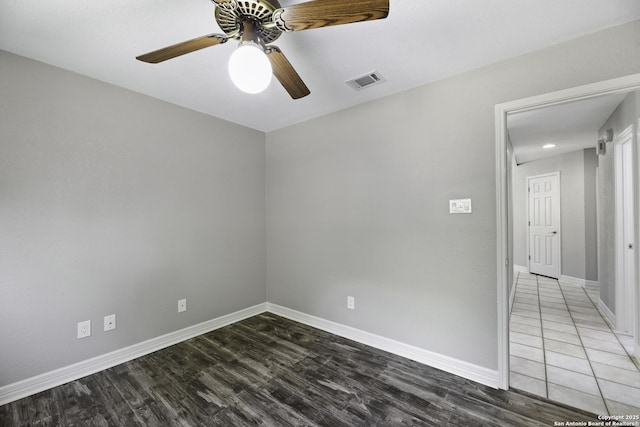 9400 Woodland Hls, San Antonio, TX 78250 - empty room featuring baseboards, wood finished floors, visible vents, and ceiling fan