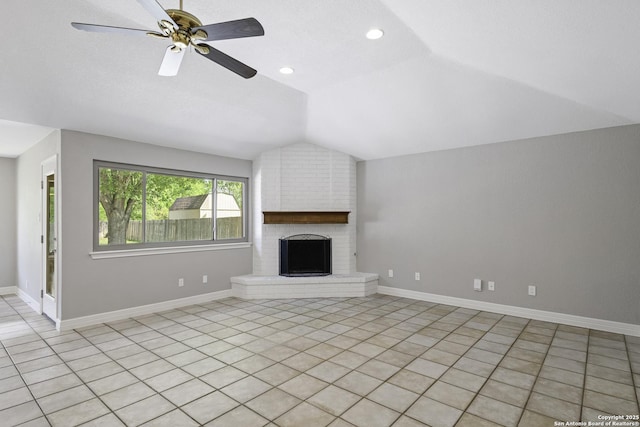 9400 Woodland Hls, San Antonio, TX 78250 - unfurnished living room with lofted ceiling, a ceiling fan, light tile patterned flooring, baseboards, and a fireplace