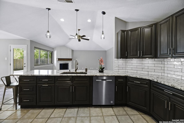 9400 Woodland Hls, San Antonio, TX 78250 - kitchen featuring a peninsula, a sink, lofted ceiling, decorative backsplash, and ceiling fan