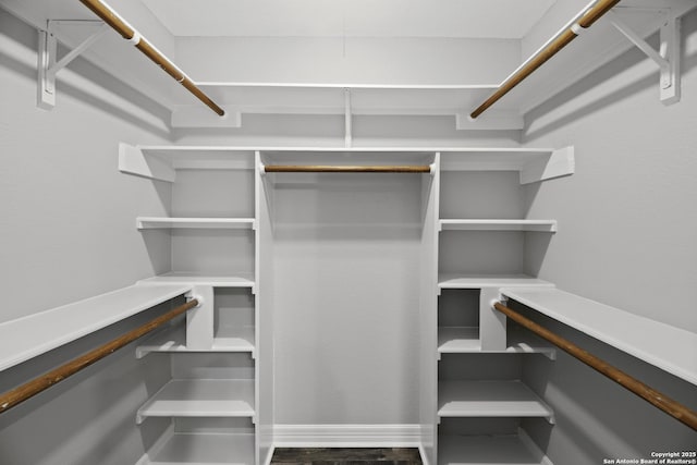 9400 Woodland Hls, San Antonio, TX 78250 - spacious closet with wood finished floors