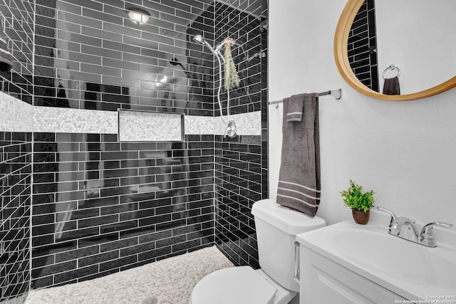 2201 San Fernando, San Antonio, TX 78207 - full bath featuring toilet, vanity, and a tile shower