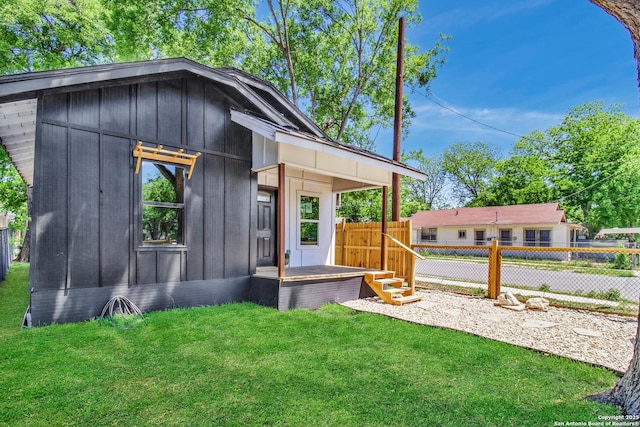 2201 San Fernando, San Antonio, TX 78207 - exterior space with board and batten siding, a lawn, and fence