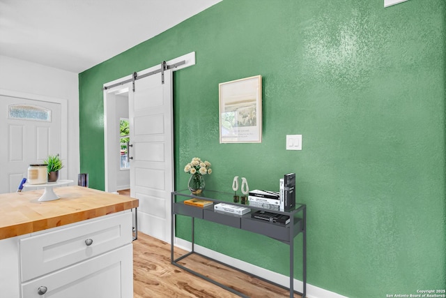 2201 San Fernando, San Antonio, TX 78207 - interior space with a barn door and light wood-type flooring